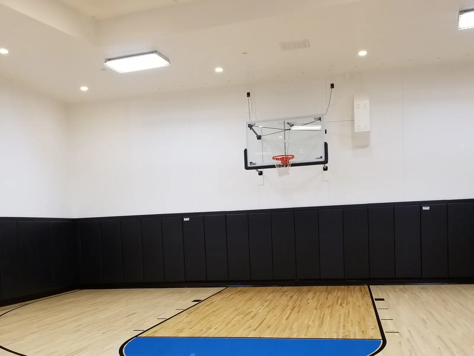 Freshly cleaned and polished indoor sport-court floor — commercial floor care
